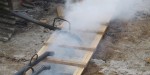 lead pouring into steaming mold